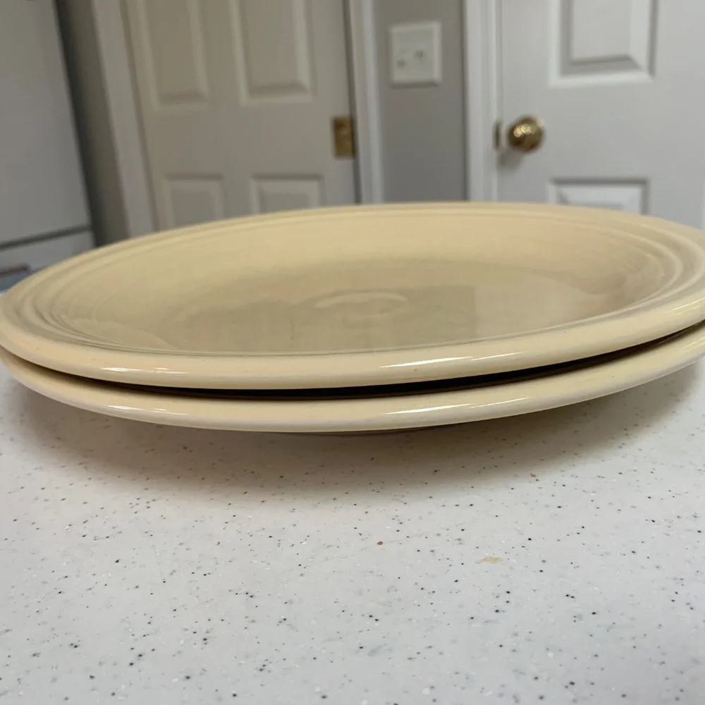 Two Fiesta Ivory Dinner Plates